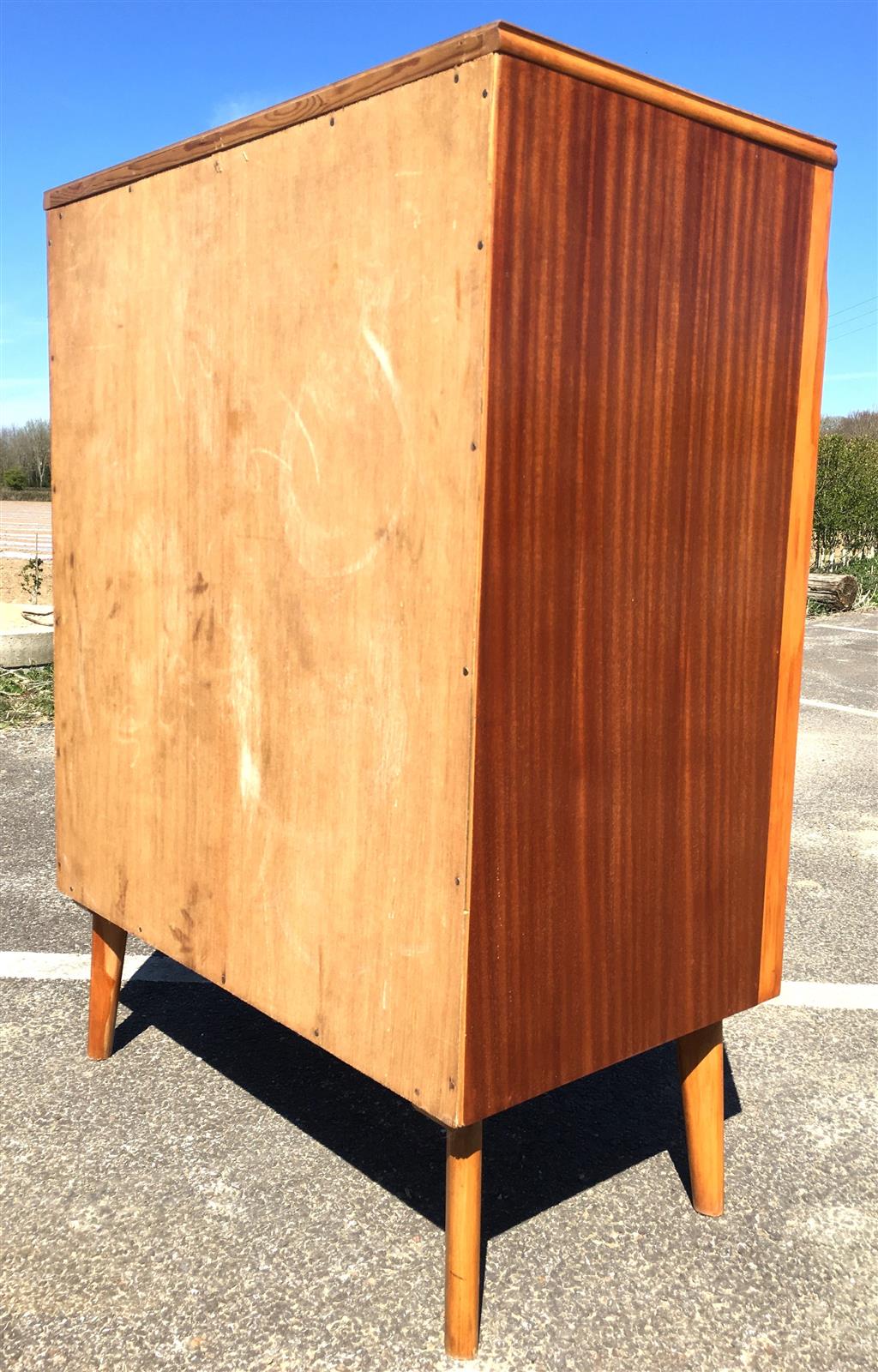 A mid century design mahogany and teak five drawer chest, circa 1960, width 77cm, depth 45cm, height 107cm